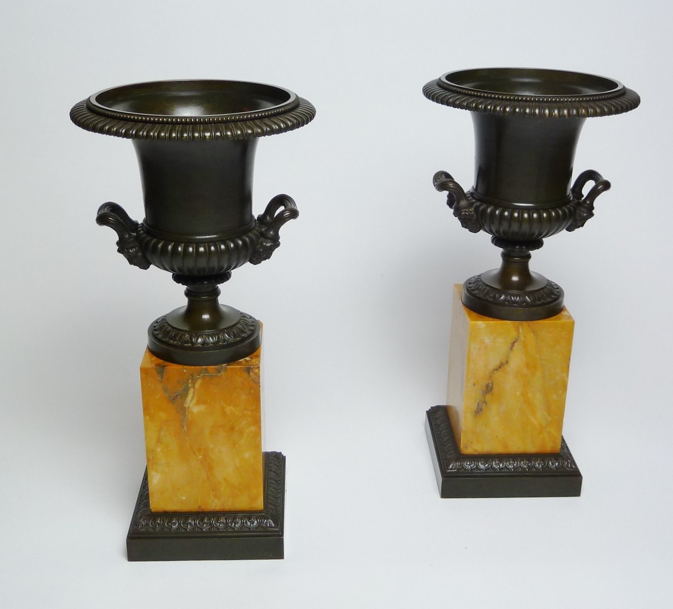 Pair Charles X Bronze Urns on Sienna marble base