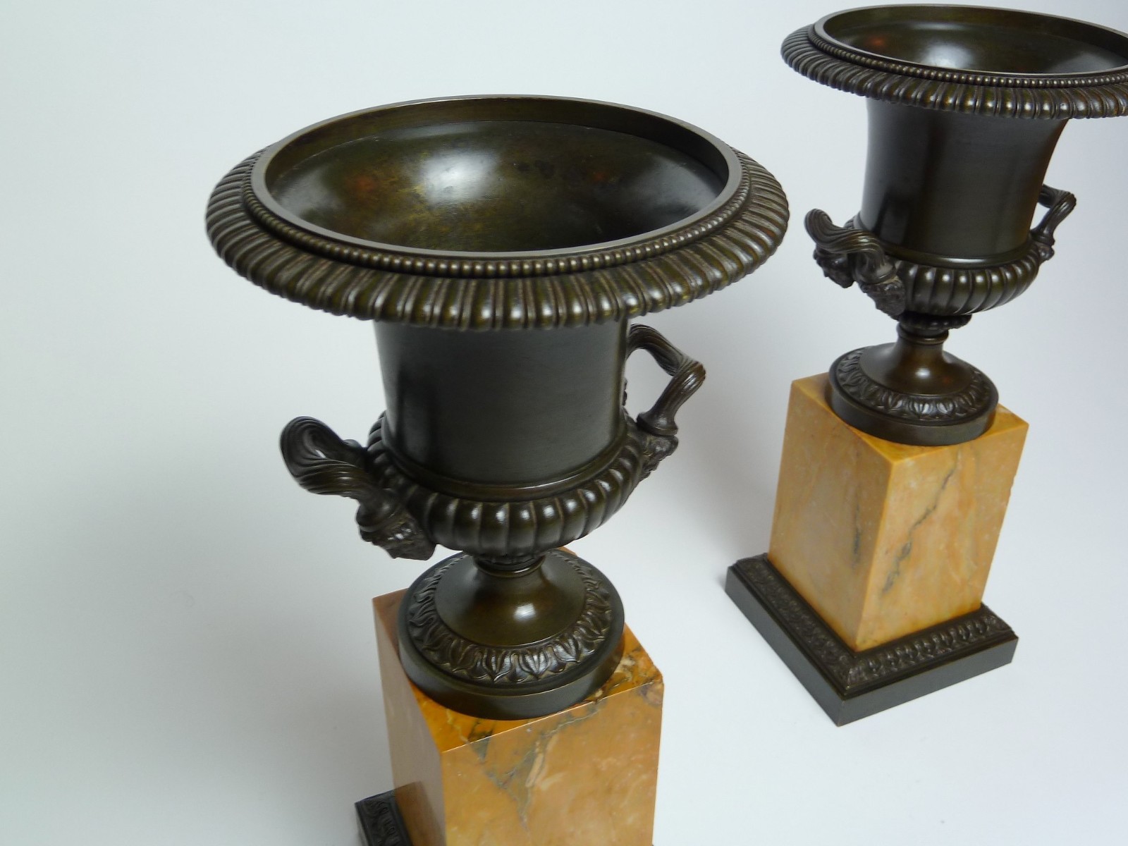 Pair Charles X Bronze Urns on Sienna marble base