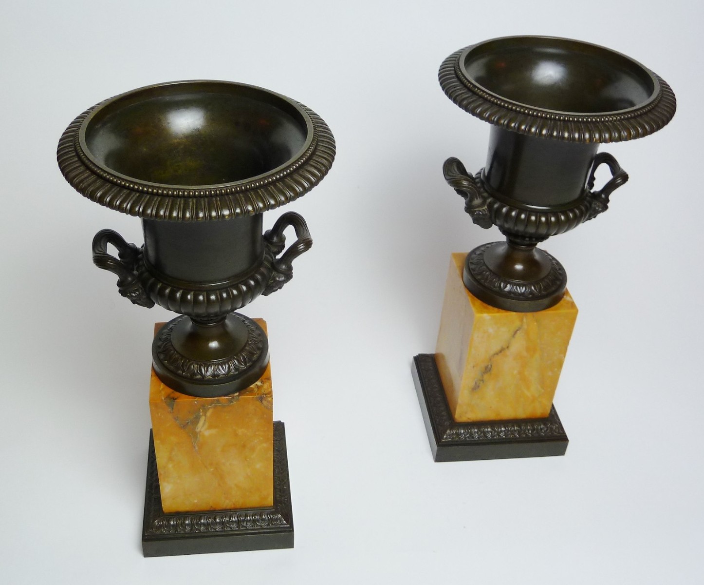 Pair Charles X Bronze Urns on Sienna marble base